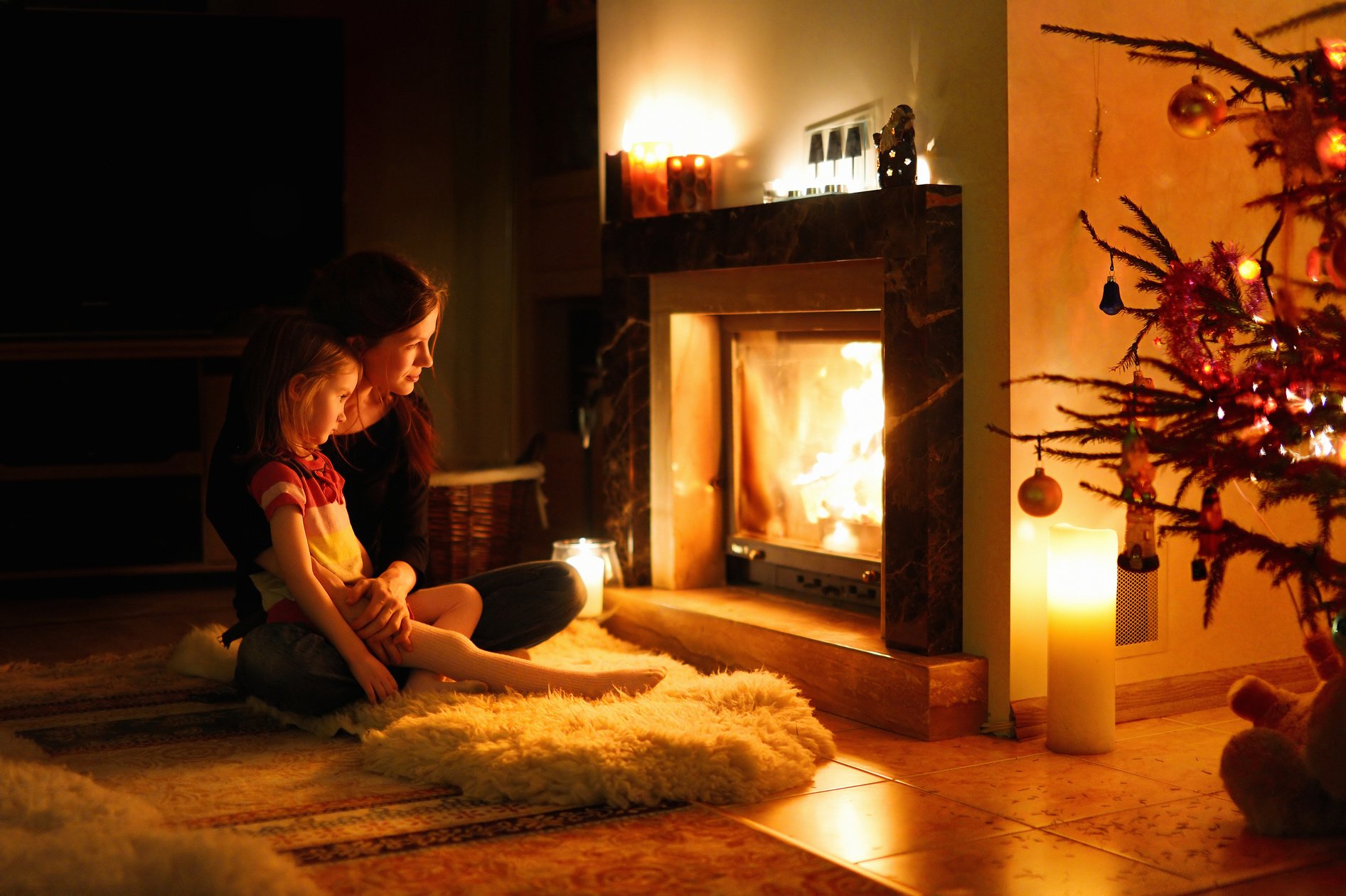 Mother and Daughter by Fireplace